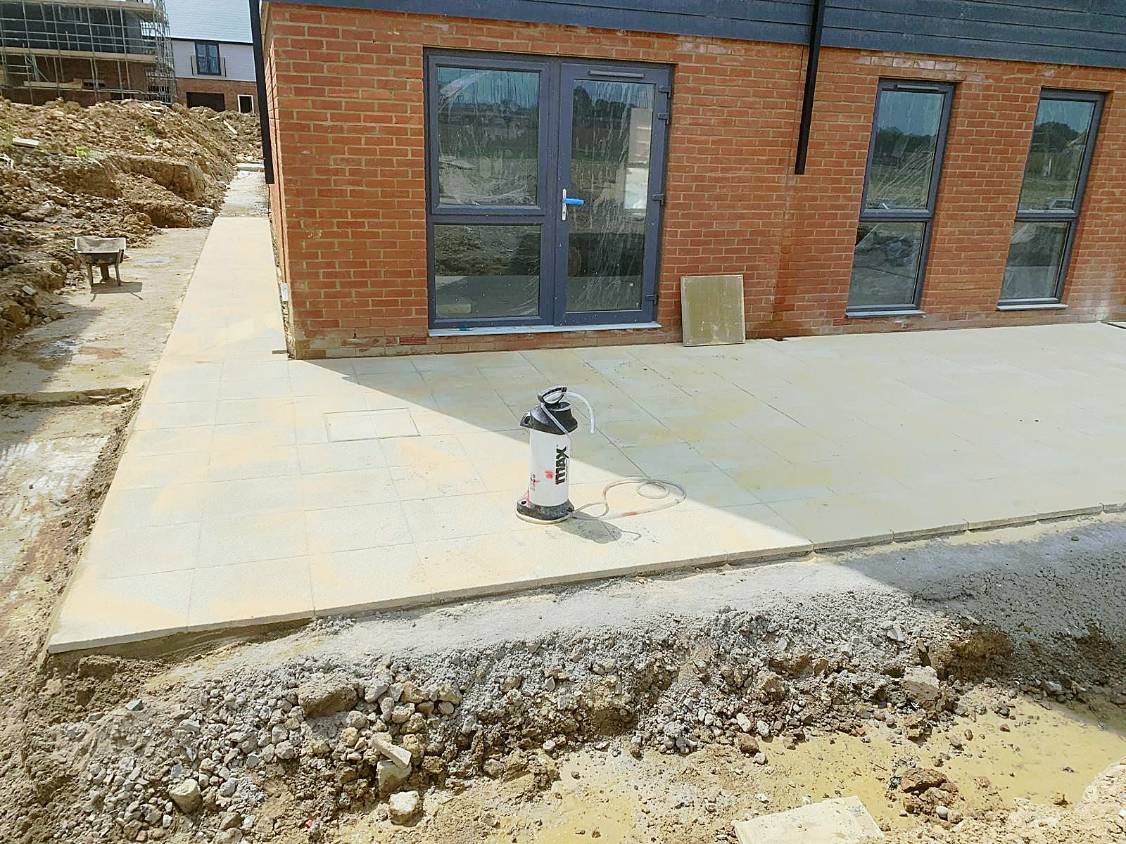 Buff slab patio outside the garden doors