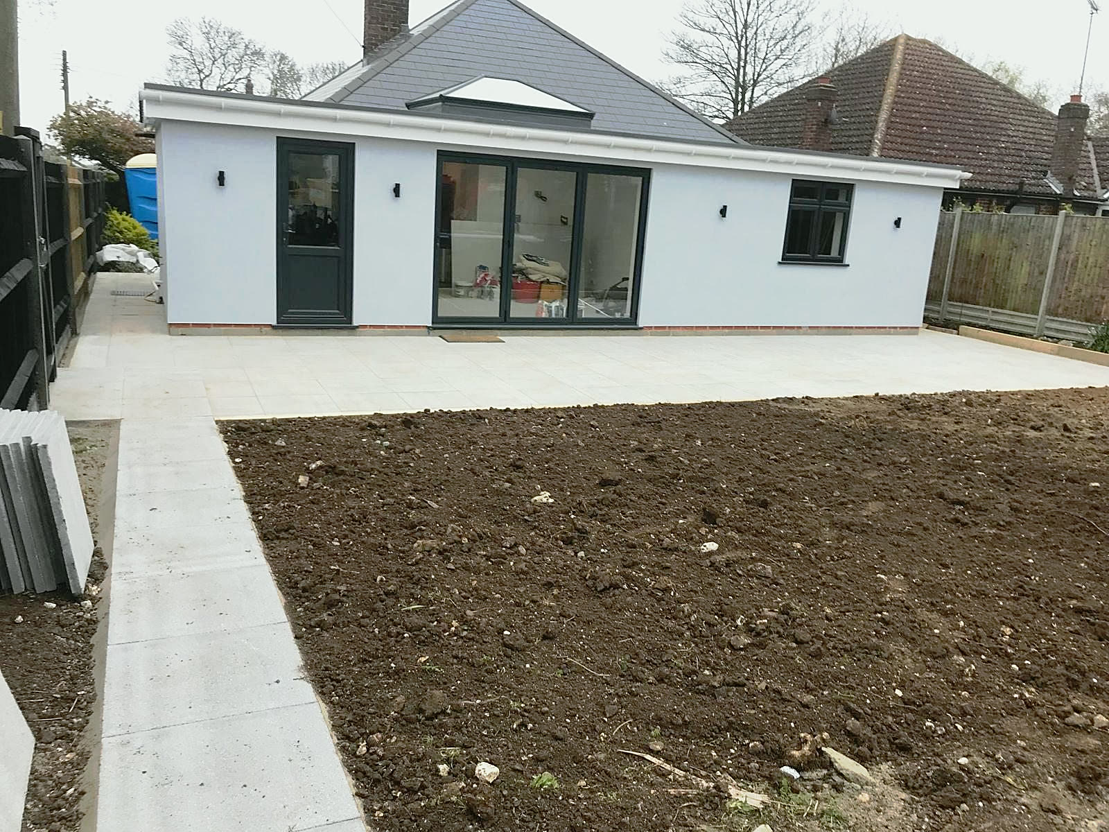 Slab patio and path around a bungalow