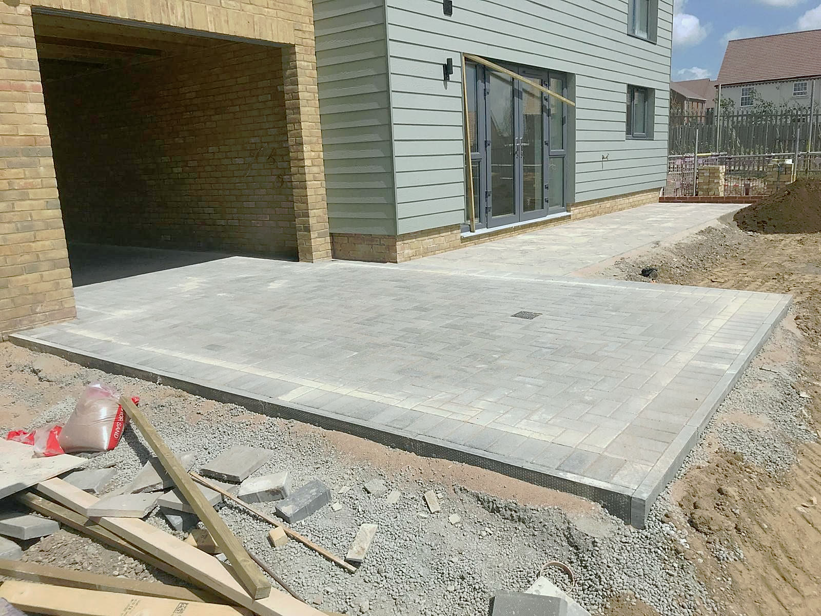 Grey block paving in front of a garage
