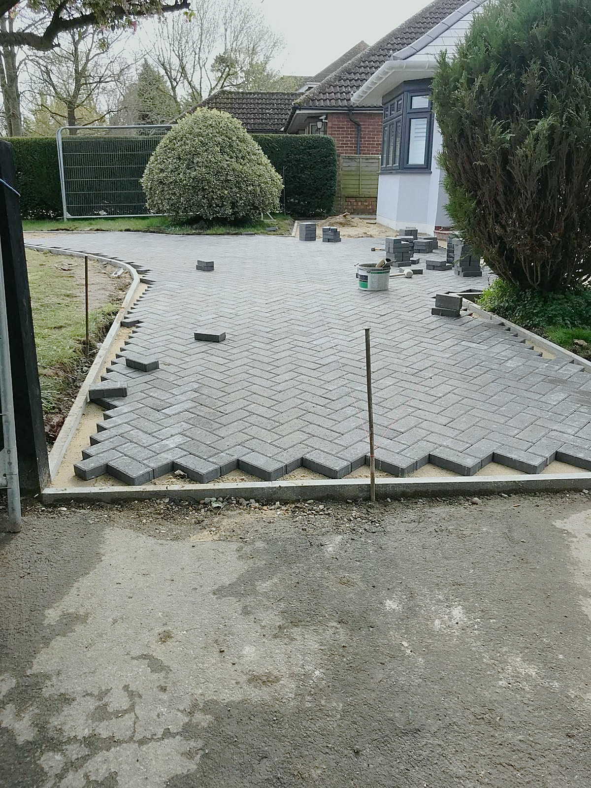 Laying herringbone blocks up to the edge course
