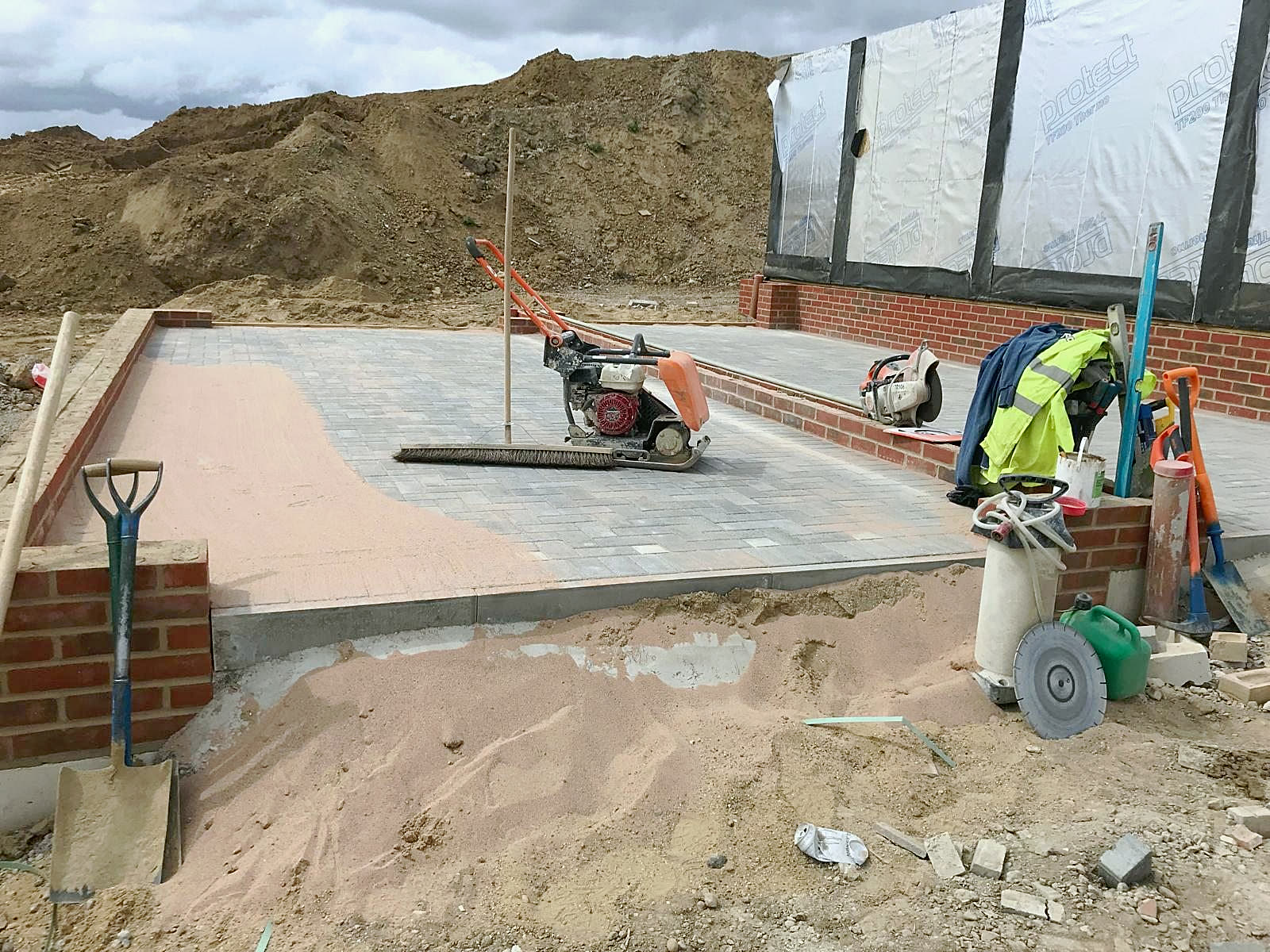 Block-paved patio, compacted before jointing