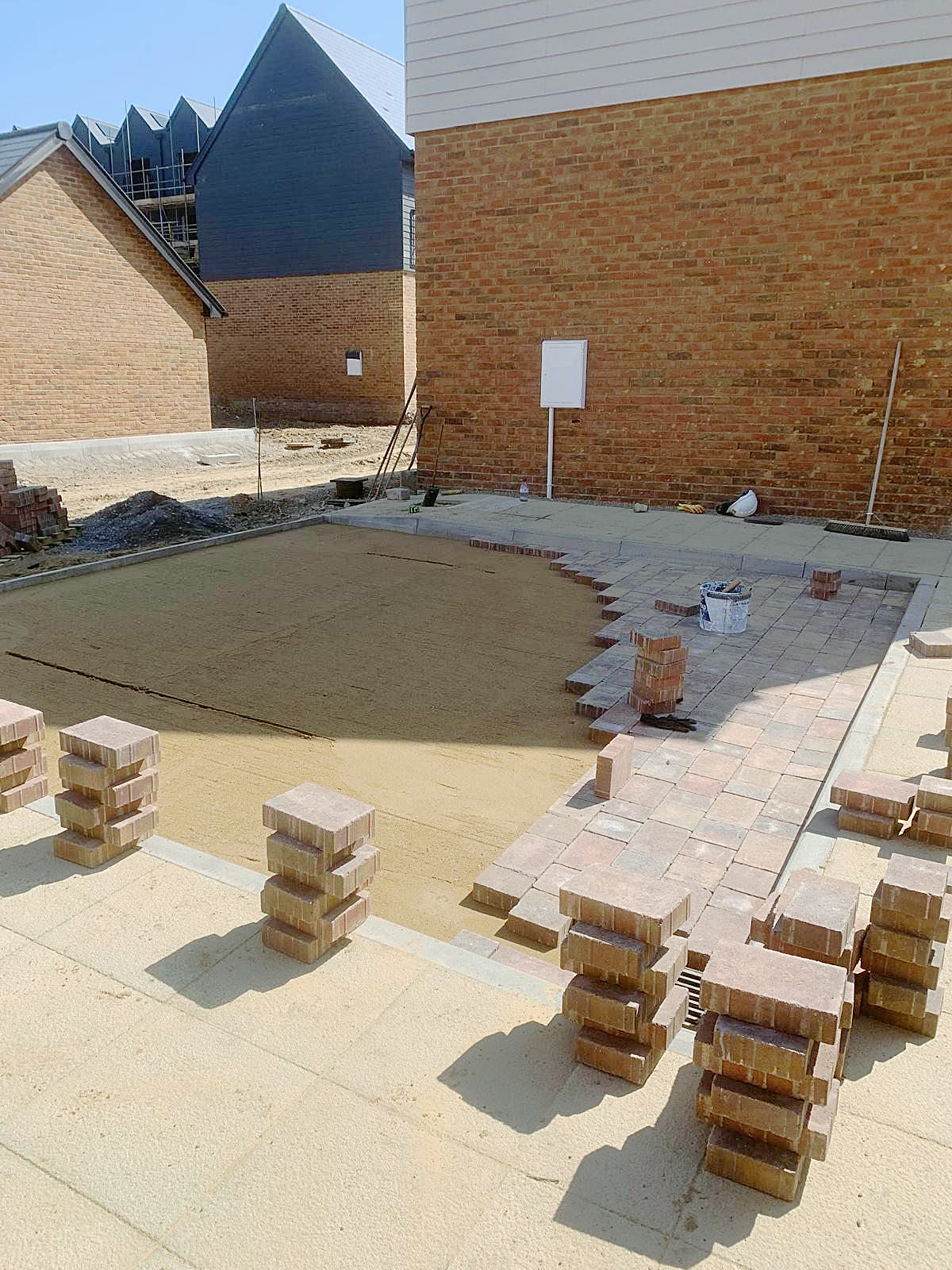 Patio with a block-paved border, in progress